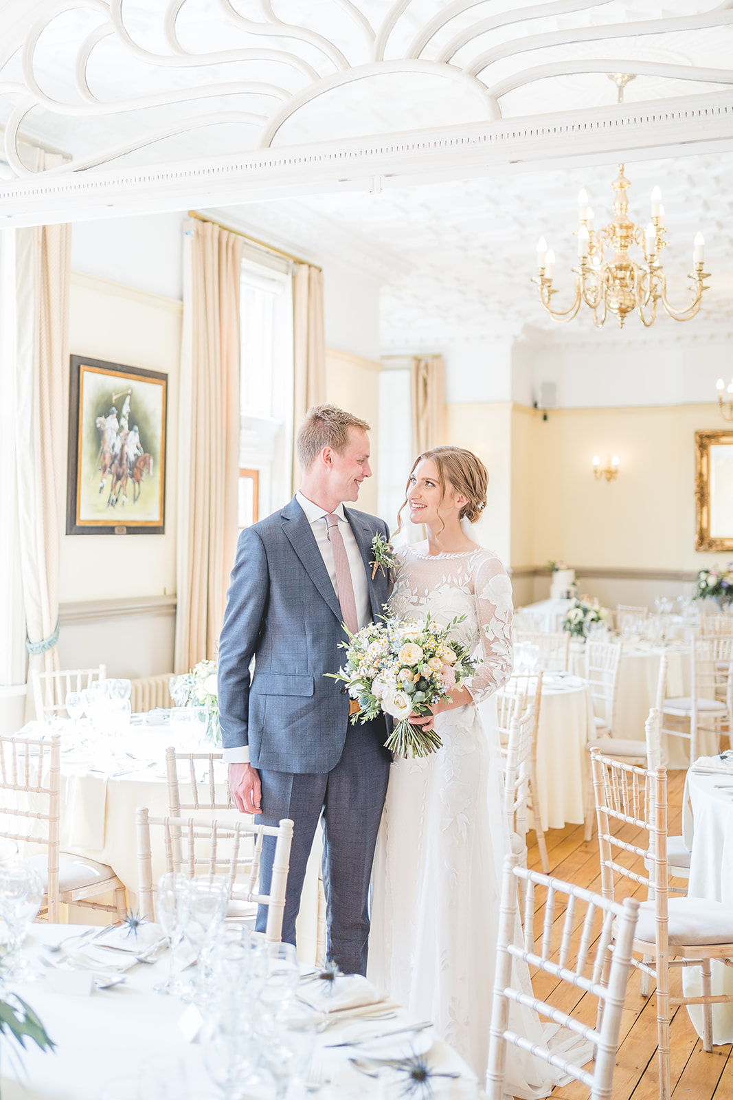 Bride and groom in intimate wedding breakfast room at nunsmere hall 