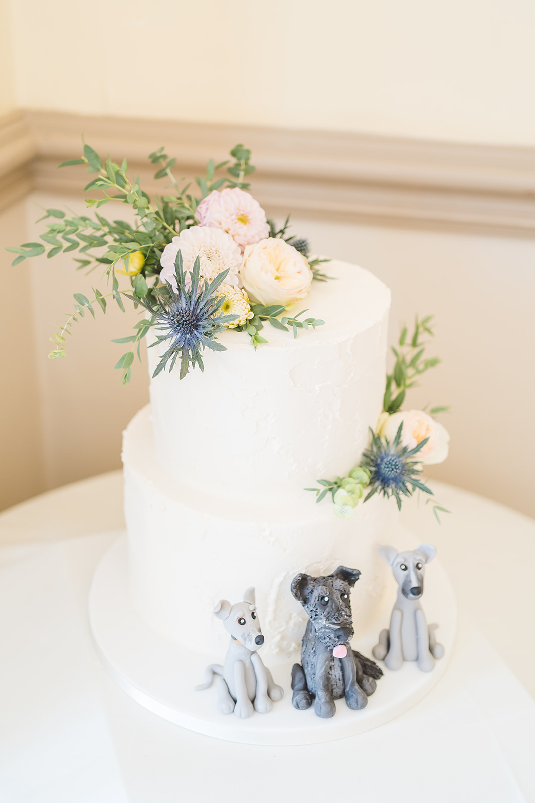 wedding cake with dogs at Nunsmere Hall