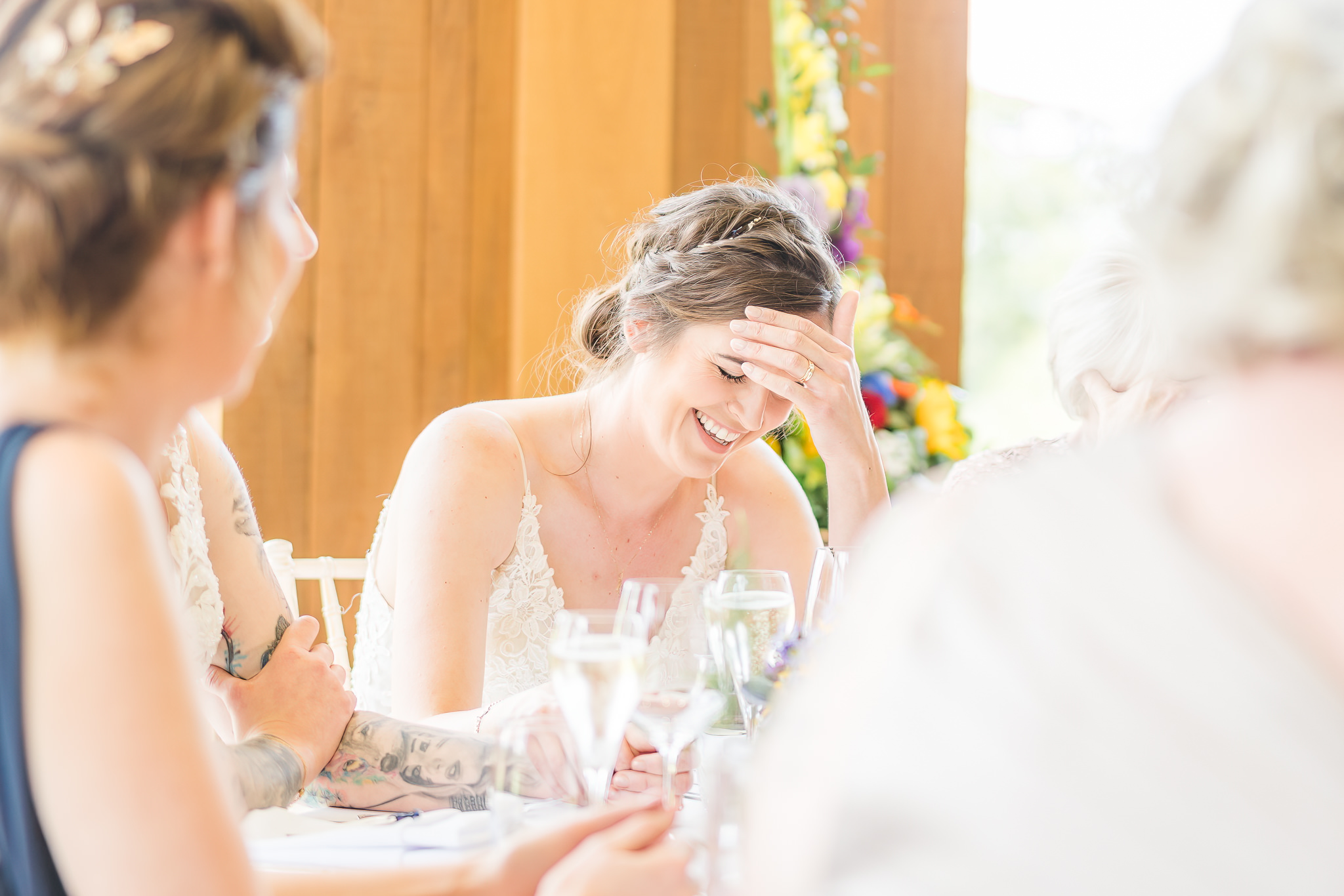 bride laughs during speeches