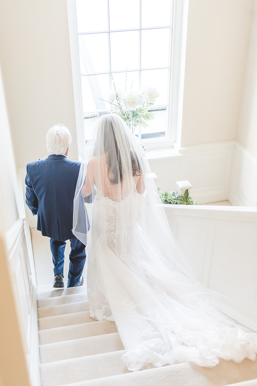 bride on stairs at Delamere Manor
