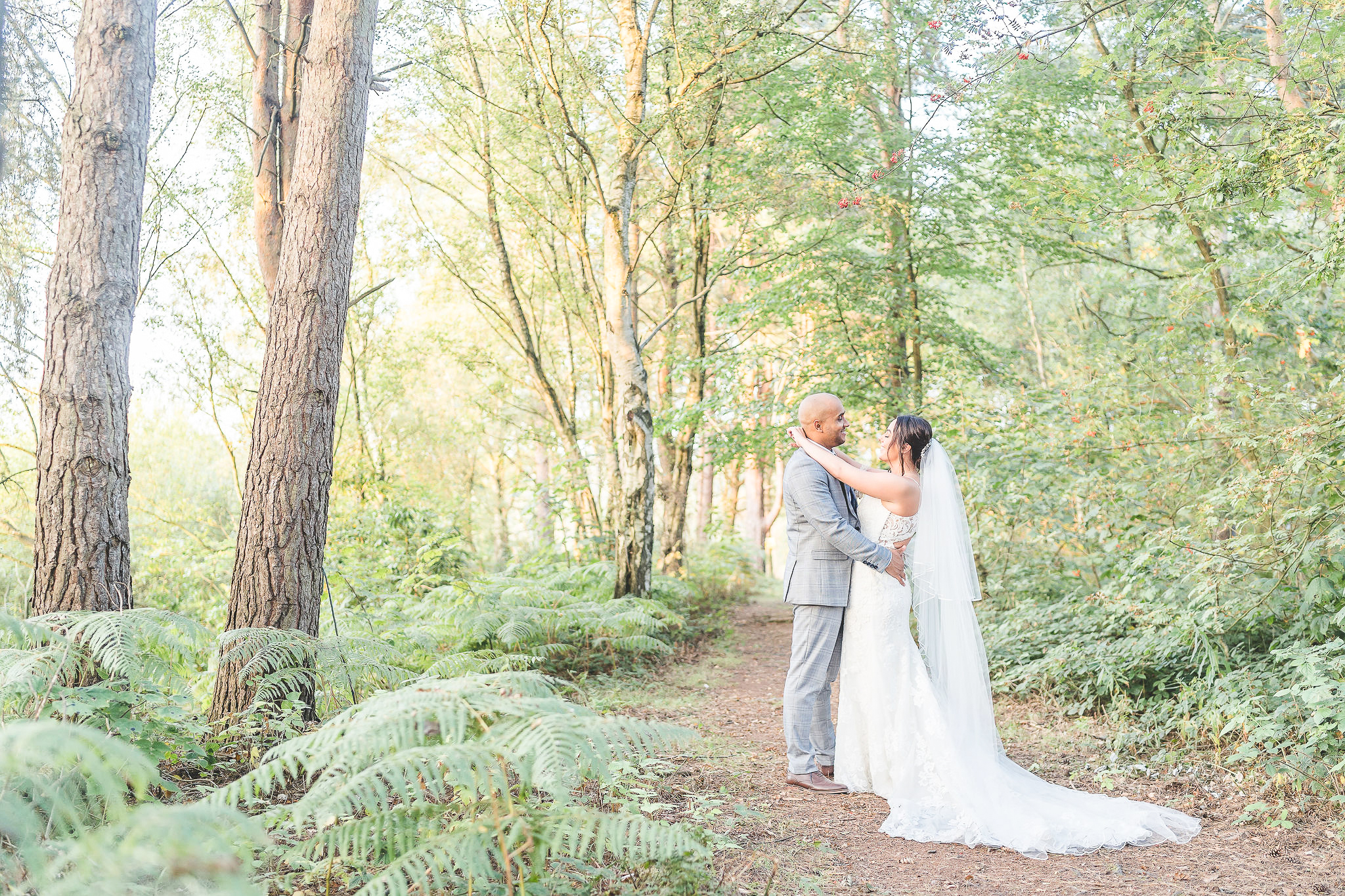 bride and groom in woodland at nunsmere hall