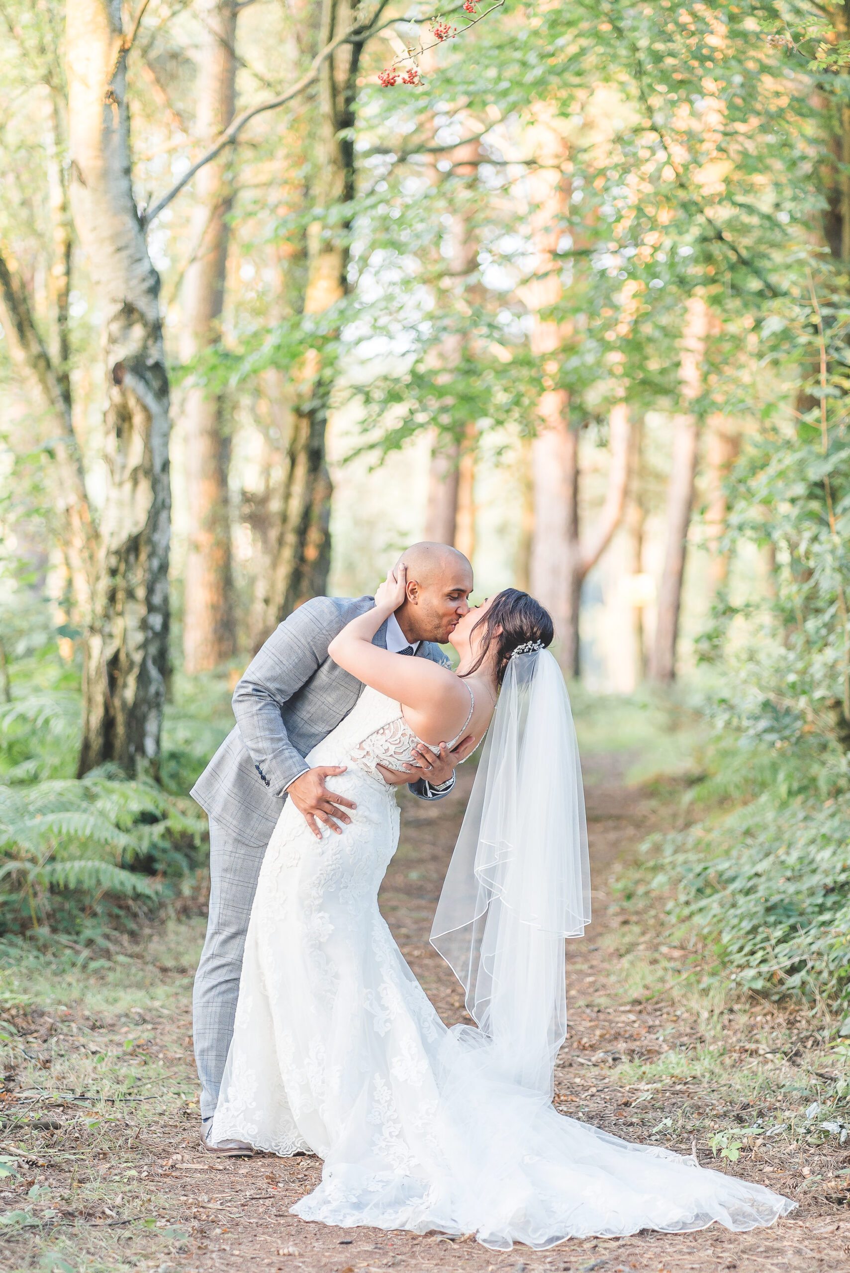 bride and groom in woodland at nunsmere hall