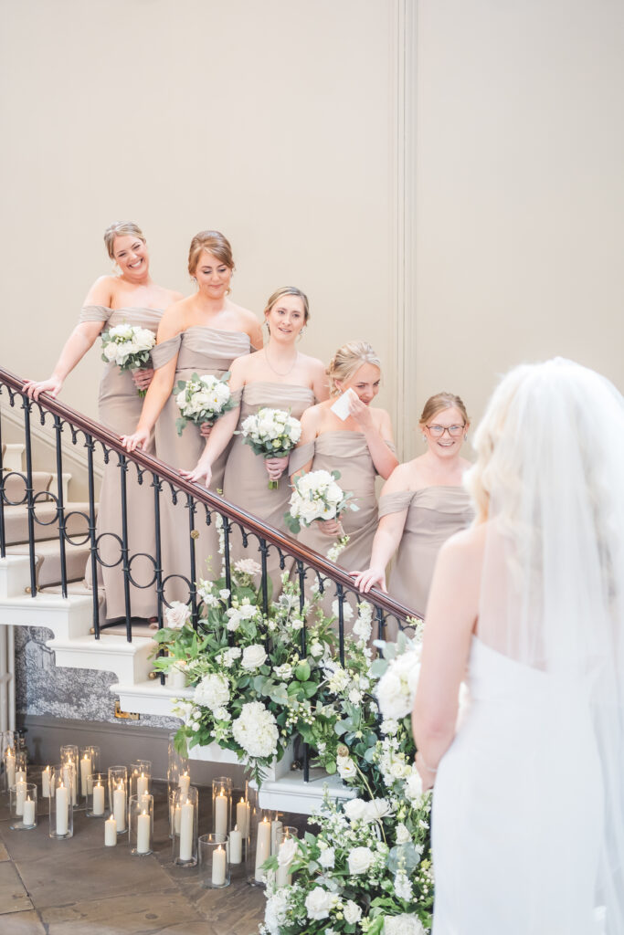 bridesmaids reveal on the stairs at Saltmarshe Hall Wedding