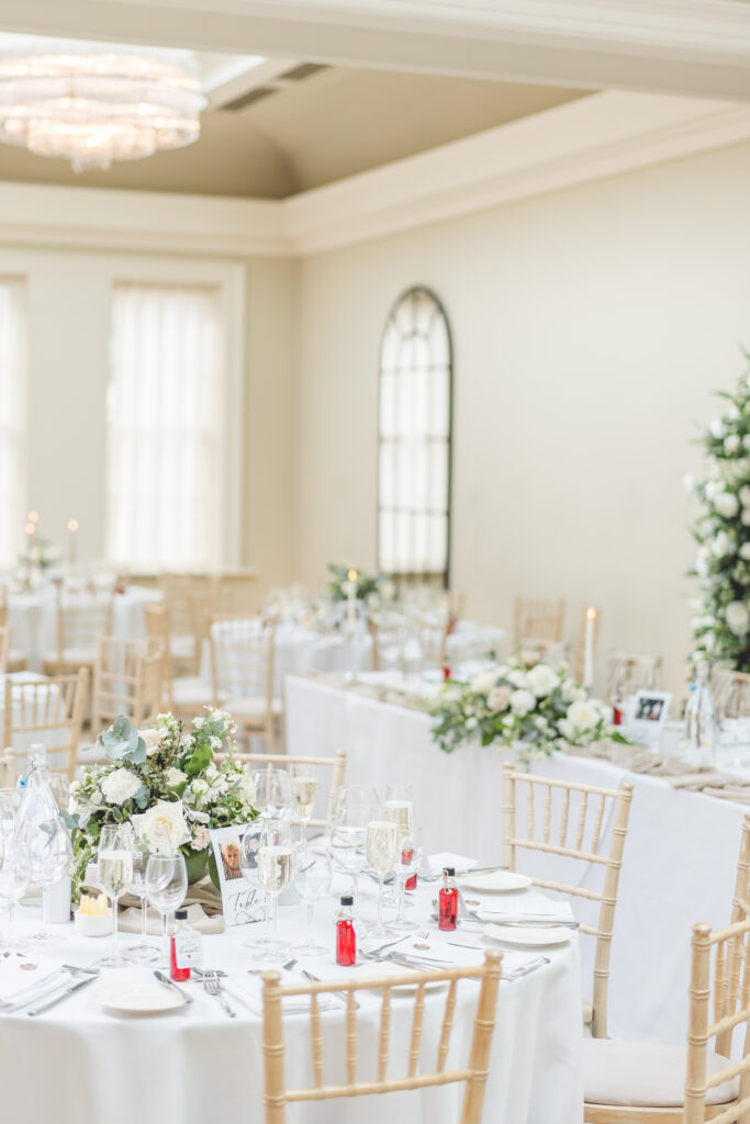 reception room dressed with white and green flowers at Saltmarshe Hall Wedding