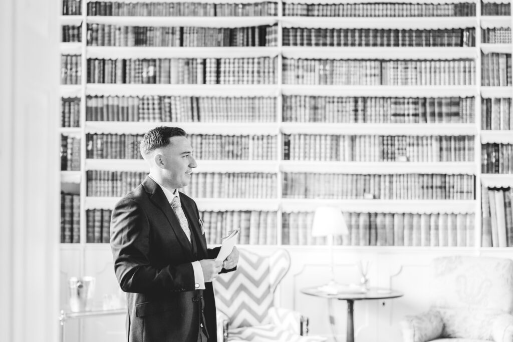 groom in the library at iscoyd park